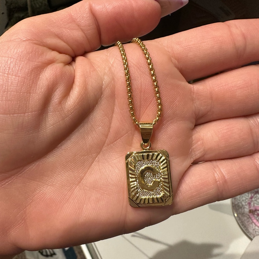 Gold “C “ pendant necklace